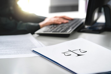 Attorney with computer. Lawyer working in law firm and company. Solicitor or jurist doing...