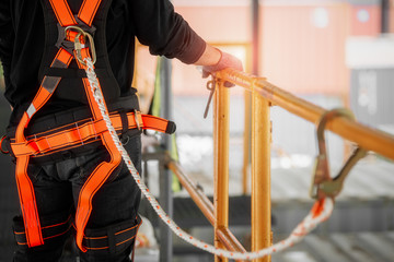 Construction worker wearing safety harness and safety line working high place at industrial. - 232436808