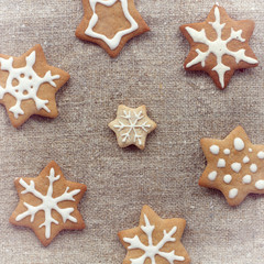 sweets for winter holidays snowflake ginger cookies on a linen napkin top view