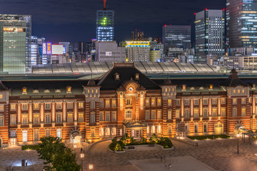 Night view of Marunouchi side of Tokyo railway station in the Chiyoda City, Tokyo, Japan.  The station is divided into Marunouchi and Yaesu sides in its directional signage.