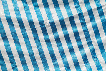Creased plastic polyethylene film with stripes