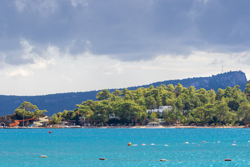 Fototapeta premium Kemer, Turkey, empty coast and empty beach after the end of the season, the wonderful, turquoise waters of the Mediterranean Sea