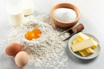 Ingredients for dough and pastry on wooden table
