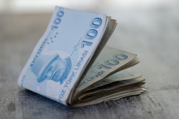 Cash Turkish Lira banknotes,blurred background.
