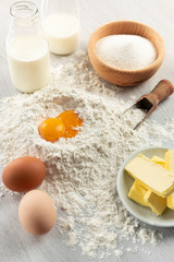 Ingredients for dough and pastry on wooden table