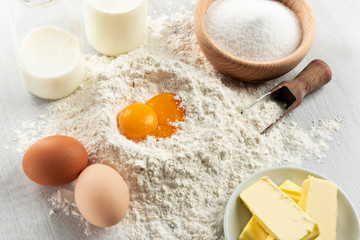 Ingredients for dough and pastry on wooden table