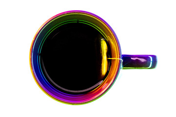 Filled cup of tea with tea bag from top with colorful lighting