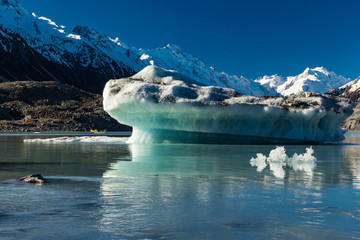 Tasman Glacier Lake with icebergs and mountains, Aoraki Mount Cook National Park, New Zealand