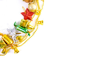 Christmas frame of decor balls, garland, beads, reindeer red pink blue golden decorations on white background. Top view.