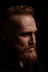 portrait of serious young man Isolated on black background and looking at camera Confident concept