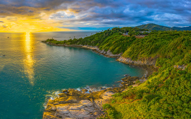 Fototapeta na wymiar panorama sunset above Promthep cape is a mountain of rock that extends into the sea in Phuket Thailand..Promthep cape is the most popular viewpoint in Phuket.