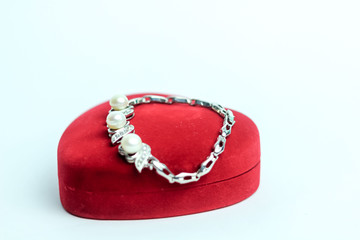 Isolate Pearl Bracelet with Silver Chain on A Red Jewelry Box