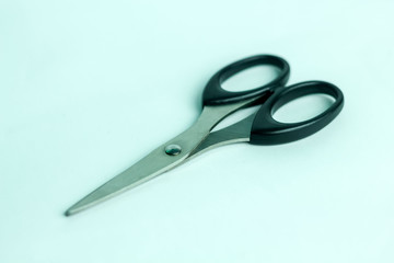 Isolated Metal Scissor with Black Plastic Handle