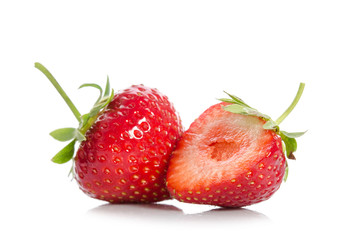  strawberries, whole one  another half,  isolated on white backgraund