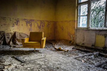 Vintage armchair in an abandoned room