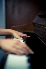 Obraz na płótnie Canvas Hands Playing on Piano Keys
