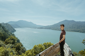 male enjoy the nature looking from above hill