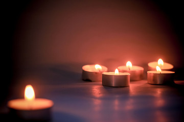 Burning Candles with Bokeh Light on a Black Background