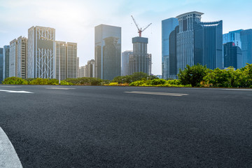 City skyscrapers and road asphalt pavement