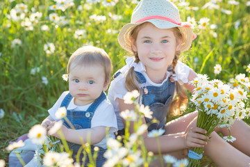 Little girl in a field with flowers