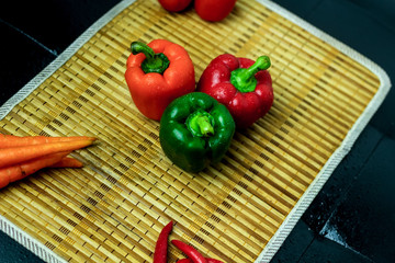 Isolated Pepper on Wooden Tray, Caprsicum