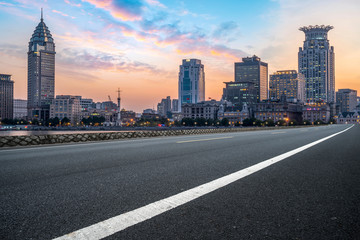 City skyscrapers and road asphalt pavement