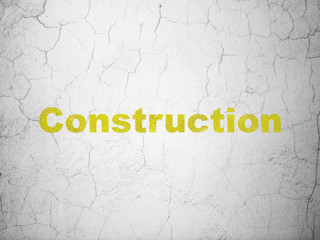 Construction concept: Yellow Construction on textured concrete wall background