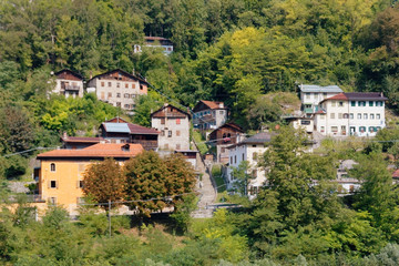 Fototapeta na wymiar Beluno, Italy August 7, 2018: Perarollo di Cadore mountain village. Houses on the mountains.