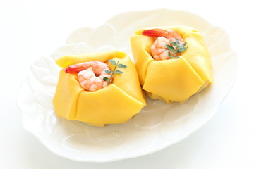 Japanese food, fried egg wrapped shrimp sushi