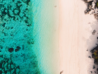 Fototapeta na wymiar Aerial view of tropical beach with crystal turquoise ocean in Seychelles