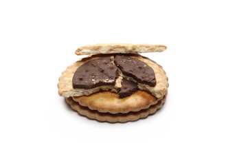 Chocolate cookies with crumbs isolated on white background