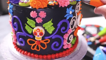 Time lapse. Step by step. Baker decorating multilayer chocolate cake with colorful italian buttercream frosting. - Powered by Adobe