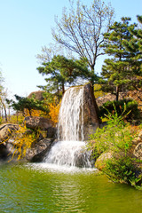 Obraz premium Waterfall and pool in the Panshan Mountain scenic spot, china