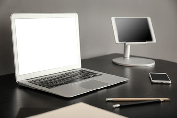 Comfortable workplace with laptop on table