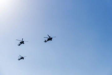 Greek Air Force Apache helicopters flying. 
2 Boeing AH-64 attack helicopters flying at 28 October military parade, commemorating the Greek no against Italian 1940 ultimatum.