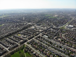 Fototapeta premium Typical UK Town aerial photo showing rows of houses, roads, parks and communal area