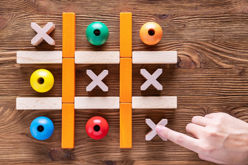 Wooden  tic tac toe (OX) game. The concept of strategy, risk, competition in business.