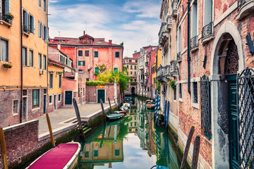 Obraz na płótnie Canvas Bright spring view of Vennice with famous water canal and colorful houses. Splendid morning scene in Italy, Europe. Magnificent Mediterranean cityscape. Traveling concept background.