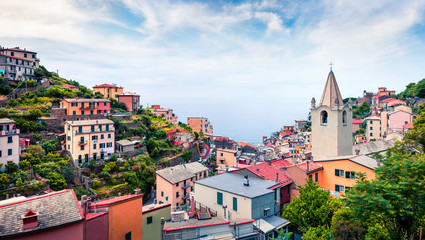 First city of the Cique Terre sequence of hill cities - Riomaggiore. Picturesque spring scene in Liguria, Italy, Europe. Traveling concept background.