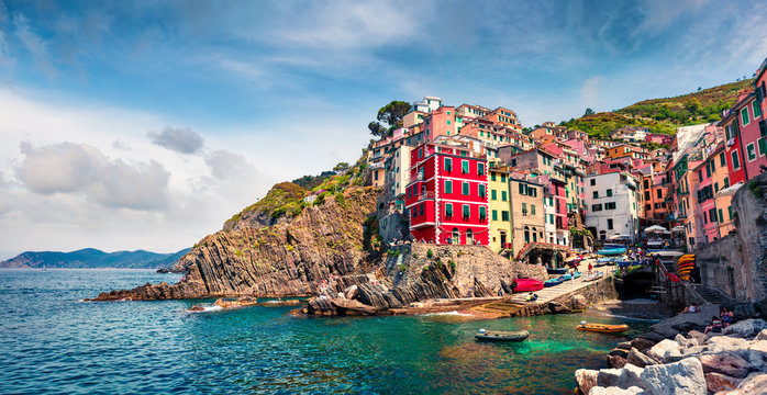 First city of the Cique Terre sequence of hill cities - Riomaggiore. Colorful morning view of Liguria, Italy, Europe. Great spring seascape of Mediterranean sea. Traveling concept background.