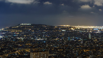 Obraz premium View of Barcelona timelapse, the Mediterranean sea, montjuic mountain from Bunkers Carmel. Catalonia, Spain.