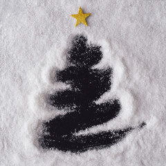 Christmas tree made in snow. Creative winter background . Flat lay, top view.