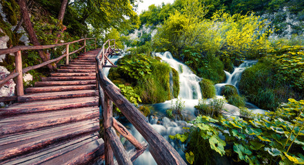 Fantastic morning view of Plitvice National Park. Colorful spring scene of green forest with pure...