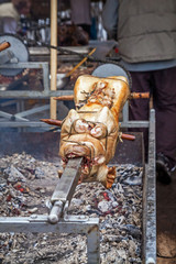 Mangalitsa pig roasted on a spit in the traditional way