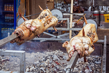 Mangalitsa pig roasted on a spit in the traditional way