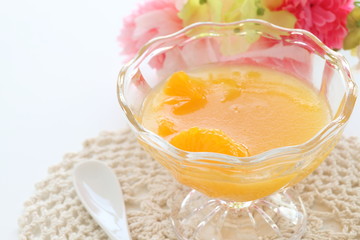 Homemade orange jelly in glass bowl for dessert imag