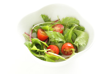 Homemade cherry tomato and baby leaves salad for healthy eating image