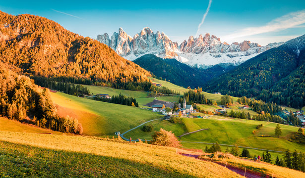 Great evening view of Santa Maddalena village in front of the Geisler or Odle Dolomites Group. Colorful autumn sunset in Dolomite Alps, Italy, Europe. Beauty of countryside concept background.