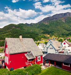 Fototapeta na wymiar Typical Norwagian architecture in Odda town, Hordaland county, Norway. Beautiful summer view of countryside. Traveling concept background.