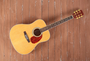 Musical instrument - Top view classic acoustic guitar wood background